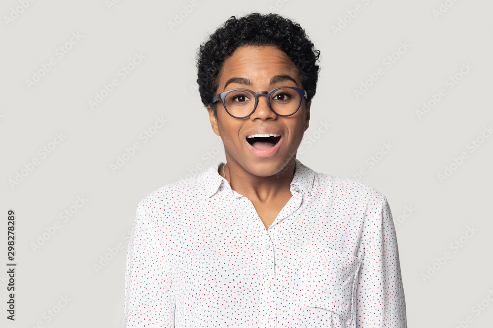 Head shot excited African American woman with open mouth Head shot excited African American woman with open mouth
