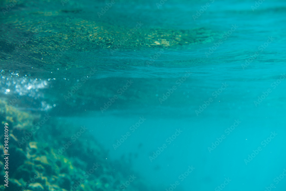 Fototapeta premium Blue underwater bokeh ,light particles. Abstract. Atlantic ocean