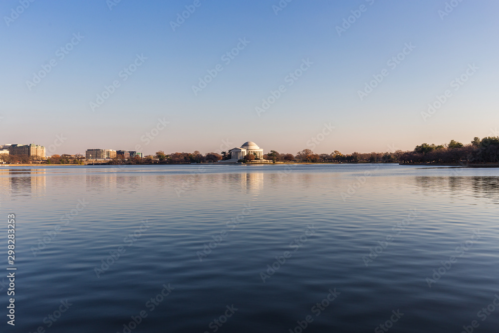Thomas Jefferson Memorial with Tidal Basin lake in front during the sunset, Washington D.C.