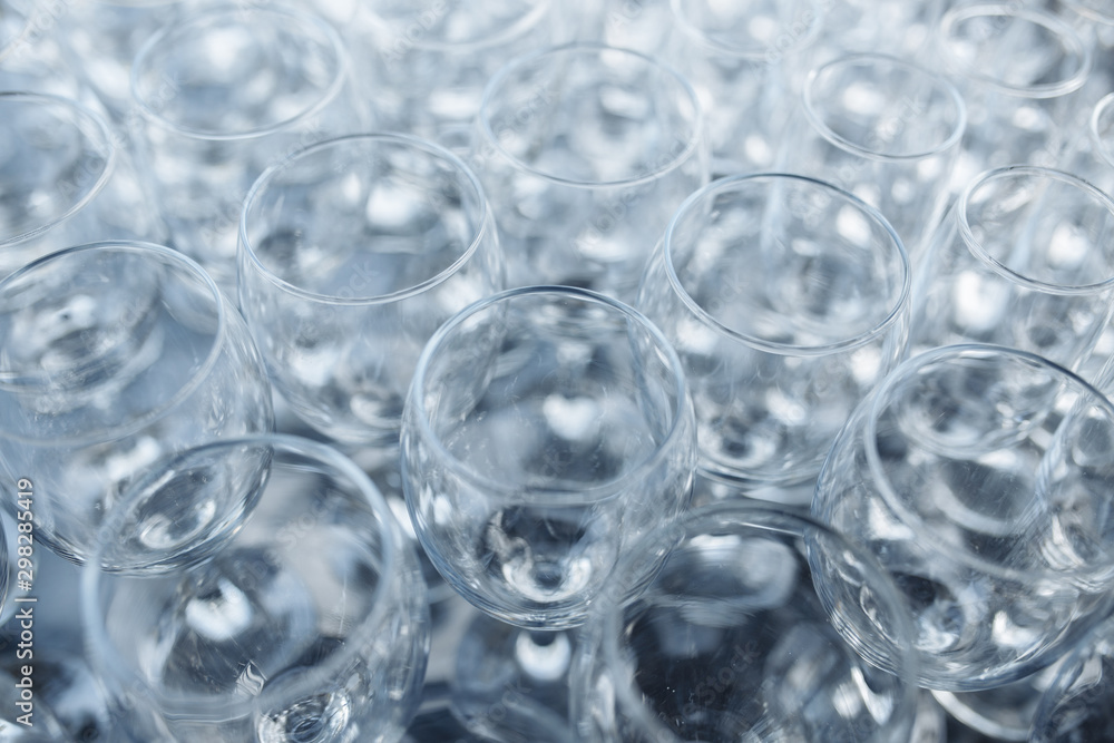 Close-up photo of empty glasses on the banquet table in natural light. Close-up photo of empty glasses on the banquet table in natural light.
