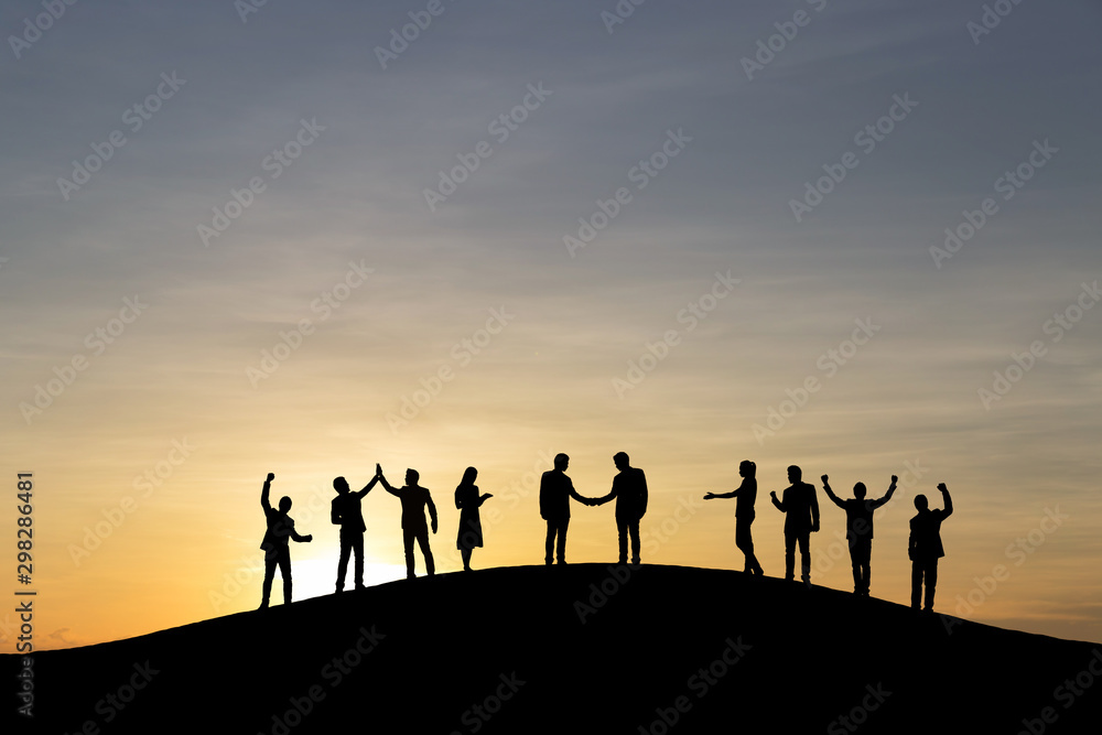 Silhouette group of business people are celebrating success at sunlight background. Business and goal concept. Silhouette group of business people are celebrating success at sunlight background. Business and goal concept.