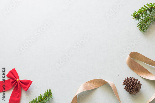 Christmas background with gift boxes, pine cone and decorations on light blue background. Preparation for holidays. Top view with copy space.