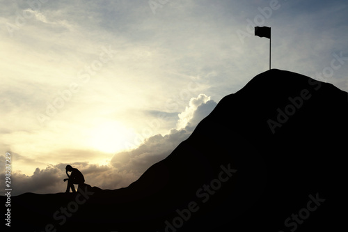 Schilderij op canvas Silhouette man are sad to not be able to climb the mountain