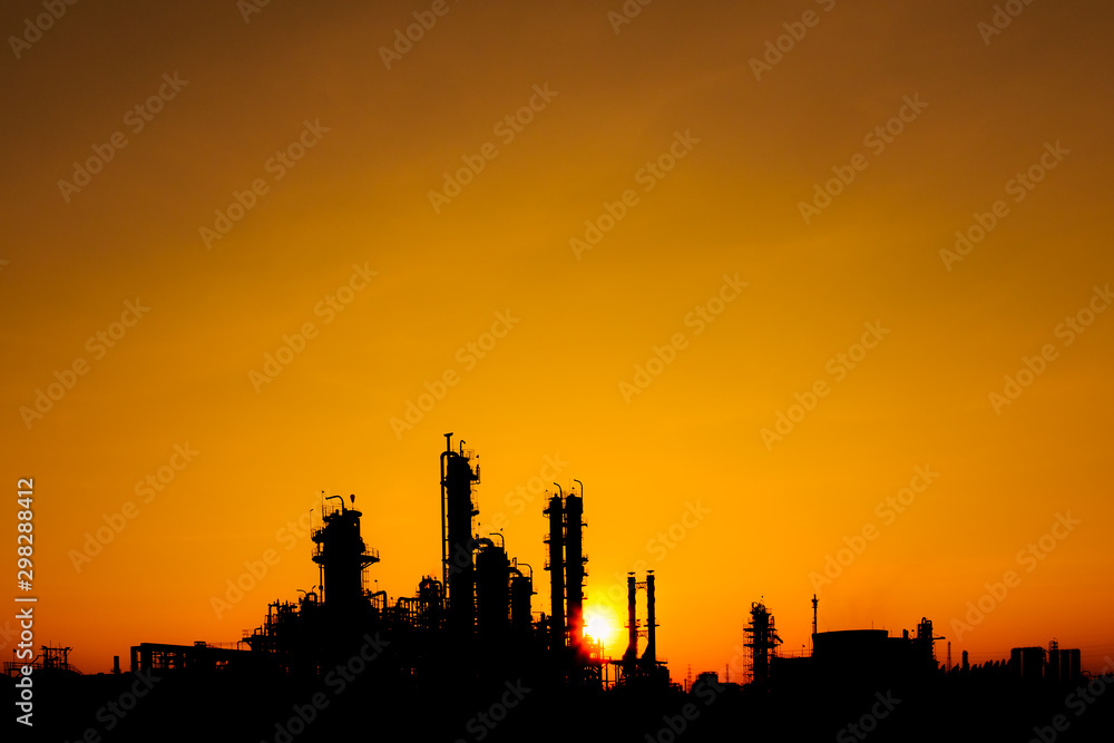 Oil and gas refinery industry in silhouette image on orange sky sunset background, Petrochemical plant, Factory of petroleum at evening