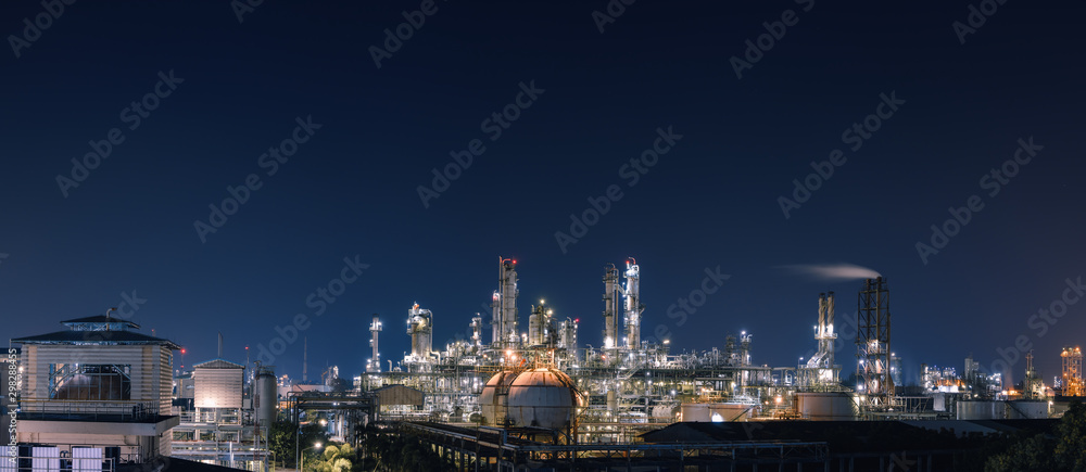 Panorama of Oil and gas refinery plant or petrochemical industry at night sky, Manufacturing of petroleum industrial business