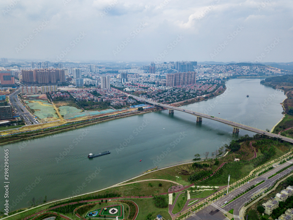 Aerial photos of high-rise buildings and parks along the river