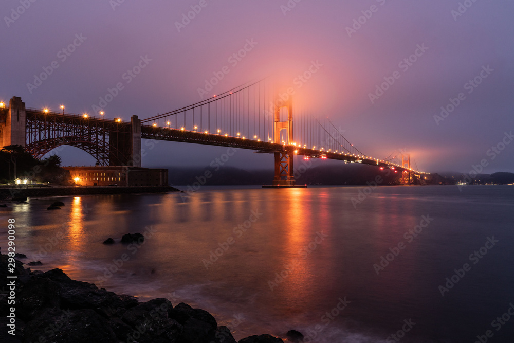 The Golden Gate Bridge Side View From San Francisco With Fog And Light Reflections