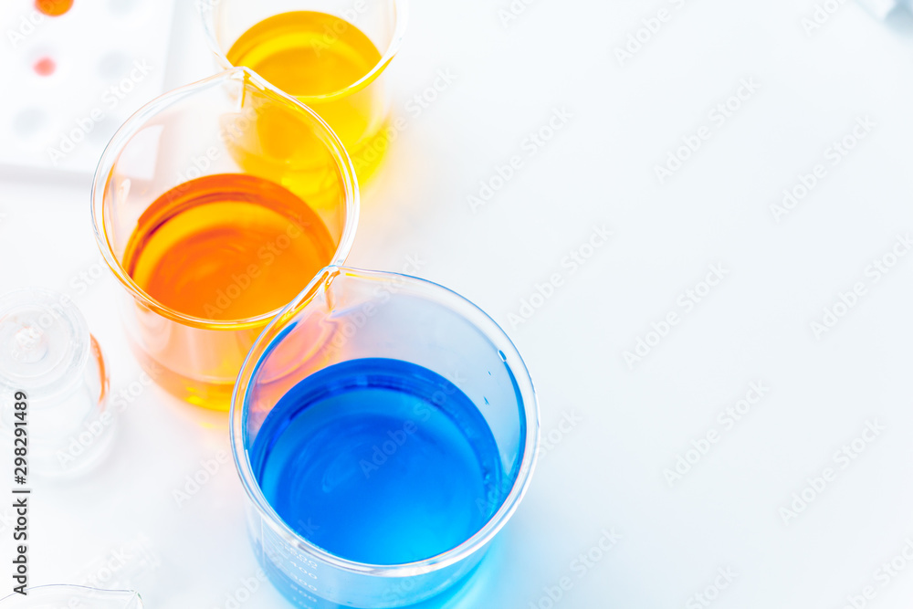 Glass beakers of various sizes in a science laboratory Used for adding chemical fluids to experiment About doing research for science Glass beakers of various sizes in a science laboratory Used for adding chemical fluids to experiment About doing research for science