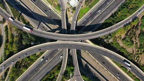 Aerial drone video of urban multilevel highway junction with light traffic