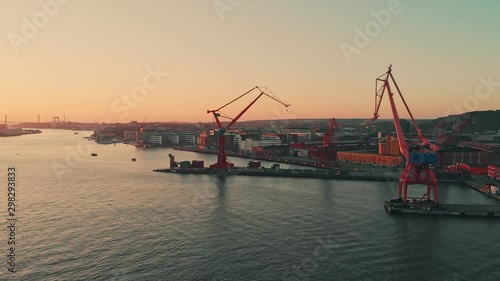 Aerial over the Gota alv river in Gothenburg at dusk. Drone slow forward dolly