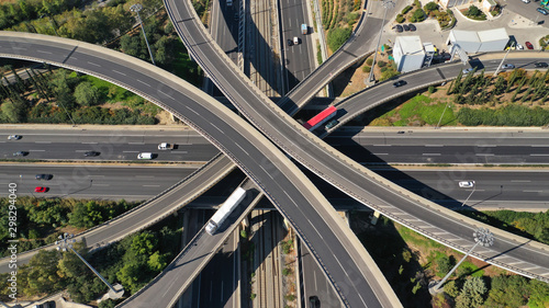 Aerial drone top down photo of urban multilevel highway junction with light traffic