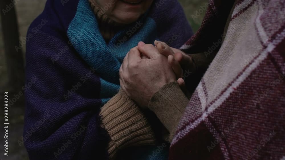 Caring aged husband comforting and supporting his crying wife, pain of loss Caring aged husband comforting and supporting his crying wife, pain of loss