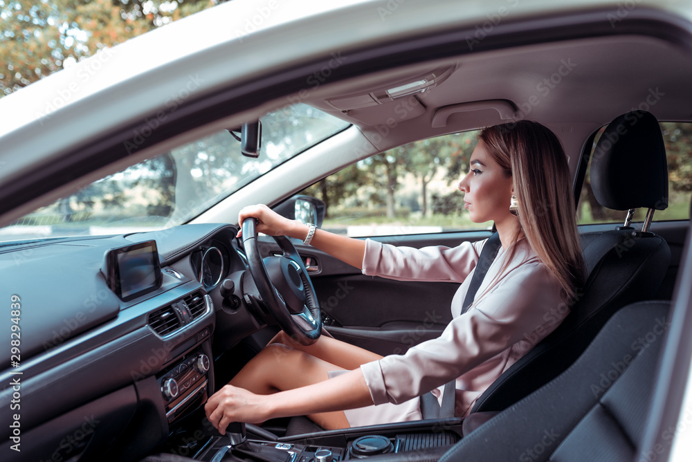 custom made wallpaper toronto digitalBeautiful girl business lady, summer city, rides car interior. Tanned skin, formal suit long hair casual makeup. Car rental, car sharing. Right-hand drive, left-hand drive, automatic transmission.