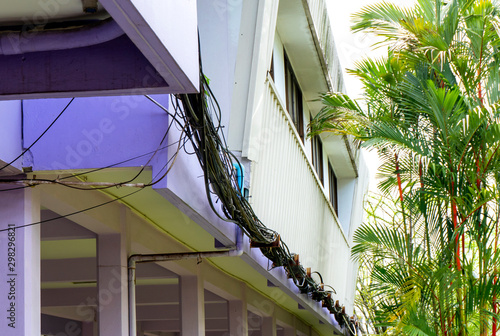 Wire and tube wiring system that is not a smooth look disorganized on the building, Look not professional and unsafe