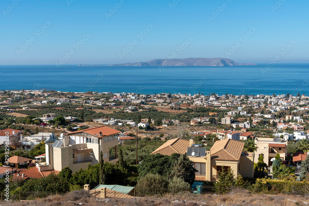 Gouves, Heraklion, Crete, Greece. October 2019. An overview of the town of Gouves towards Dia Island just of the coast and in the Sea of Crete.
