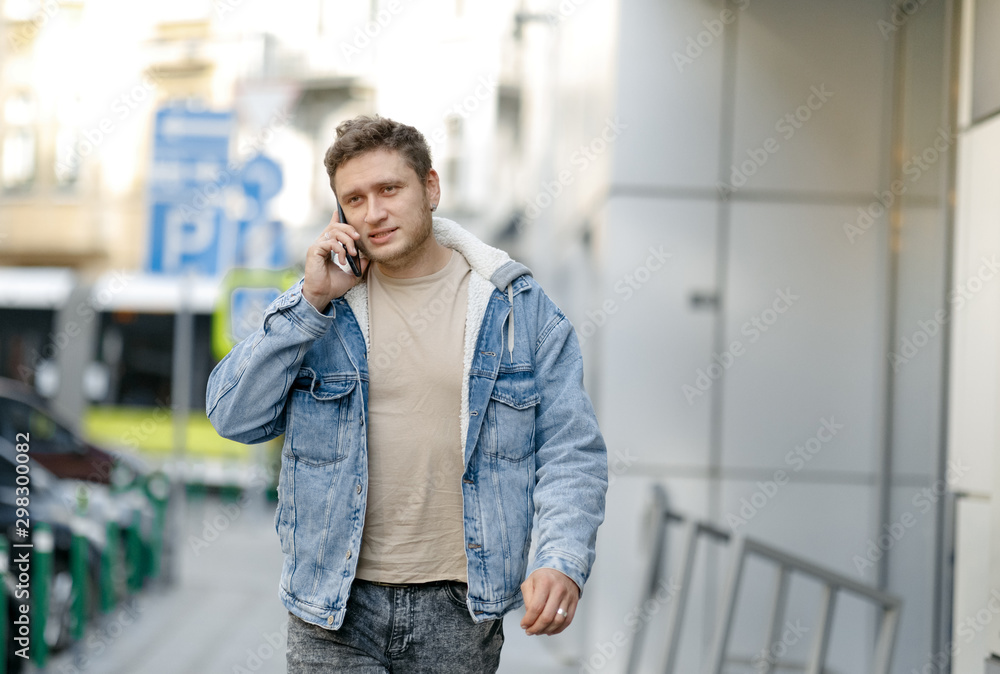 young man talking on the phone young man talking on the phone