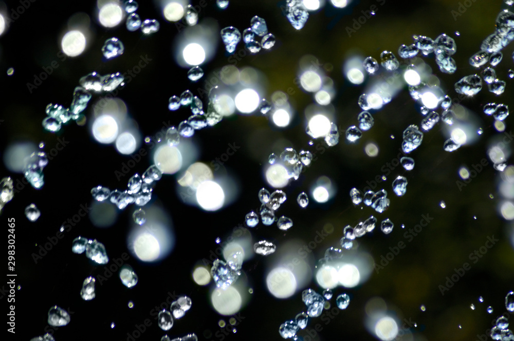 Blue water drops on dark background Blue water drops on dark background