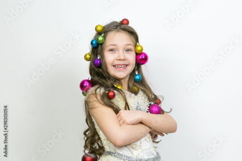 The girl experiences happiness from the coming Christmas, The joy of the child from the New Year holidays