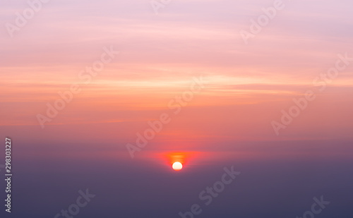 Colorful clear sky with the sun at sunset time, take photo from top of mountain in Thailand