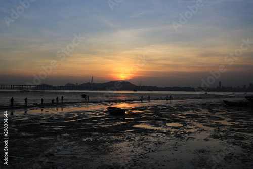 under sunset sea  scenes from hong kong to shenzhen coast at Ha Pak Nai  Yuen Long