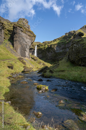 stunning view of the Kvernu Foss waterfall in a hidden valley of south western Iceland © Uwe