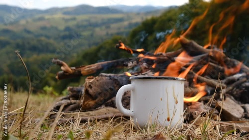Wallpaper Mural Close up of female hands throws a block of sugar in cup hot coffee near campfire with overlook amazing of mountains landscape, beautiful and inspiring camp location for outdoor vibes living lifestyle Torontodigital.ca
