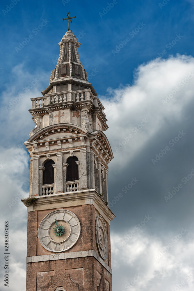 Venice, the bell tower of the Church of Santa Maria Formosa, 1492, on blue sky with clouds. UNESCO world heritage site, Veneto, Italy, Europe