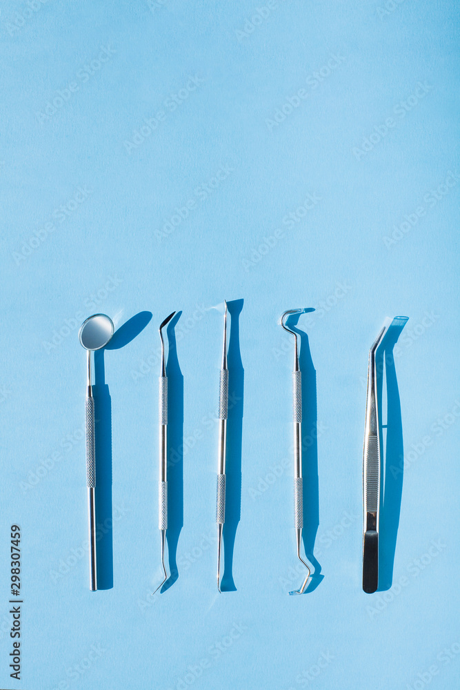 dentist tools on blue background: Dental Hygiene and Health conceptual image dentist tools on blue background: Dental Hygiene and Health conceptual image
