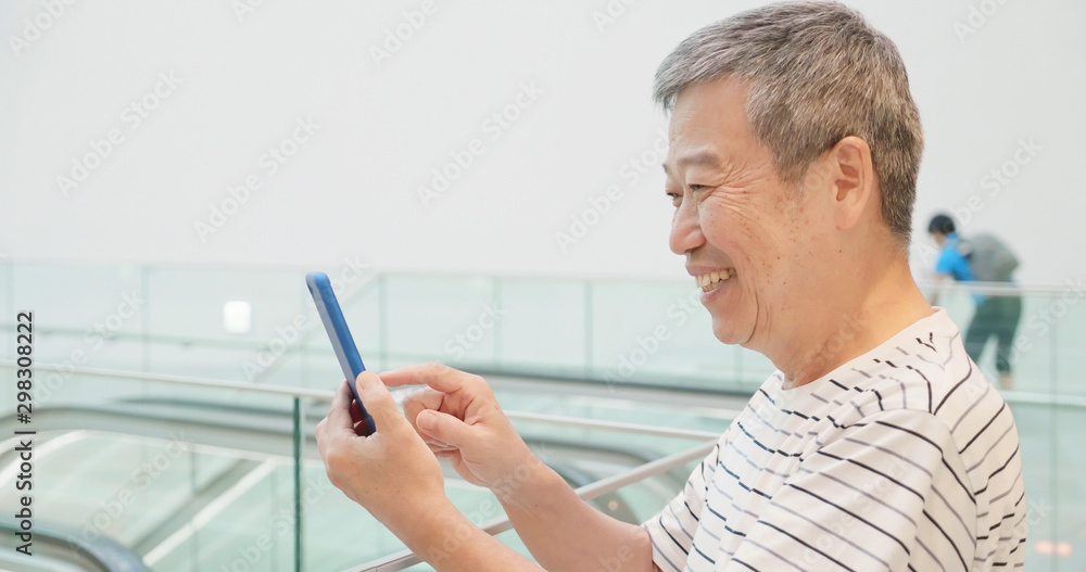 Fototapeta premium elder man use smart phone