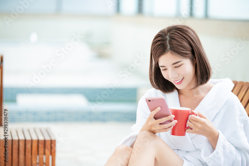 woman use smartphone happpily photo