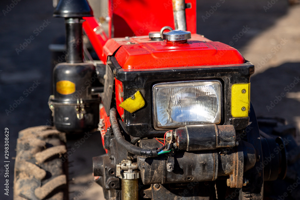 Closeup on a two wheel tractor during a sunny day. Agricultural object. Closeup on a two wheel tractor during a sunny day. Agricultural object.