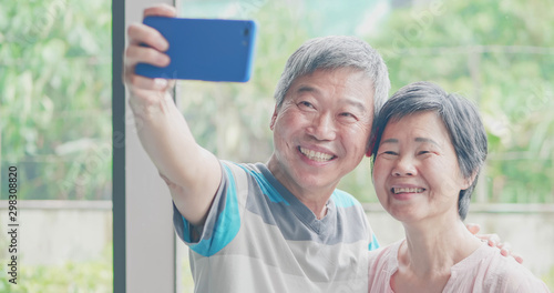 elder couple take selfie