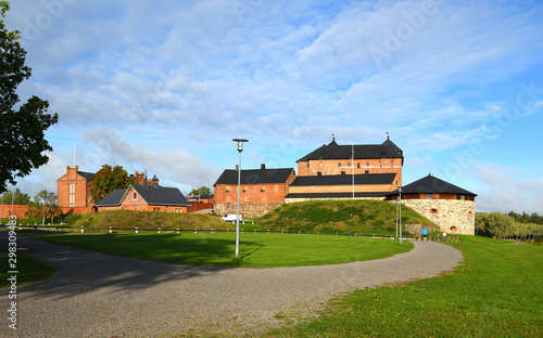 Medieval fortress on coast of picturesque lake Vanajavesi in Hameenlinna, Suomi. Autumn