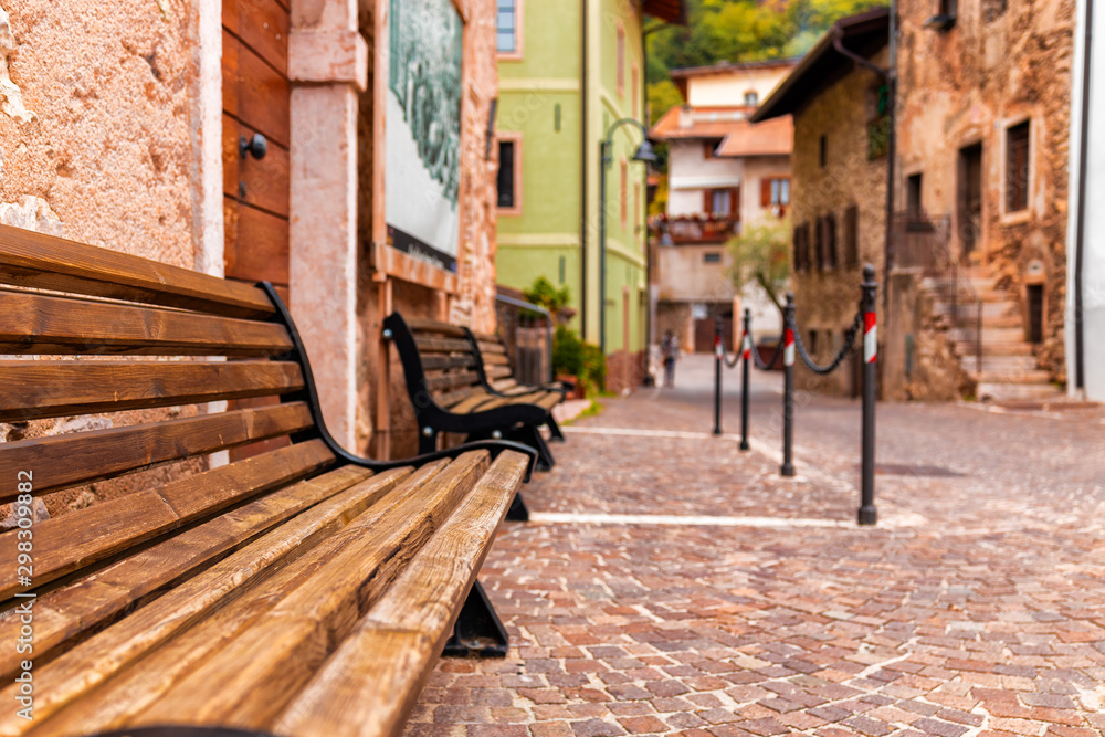 Old small stone street in Italy. City of Ranzo province of Trento. The foreground in focus, the background is blurred