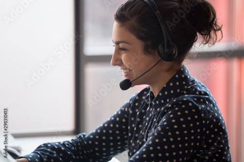 Принти на полотні Millennial happy indian call center worker consulting client.