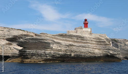Small ancient red lighthouse near Bonifacio Town in Corsica a fr