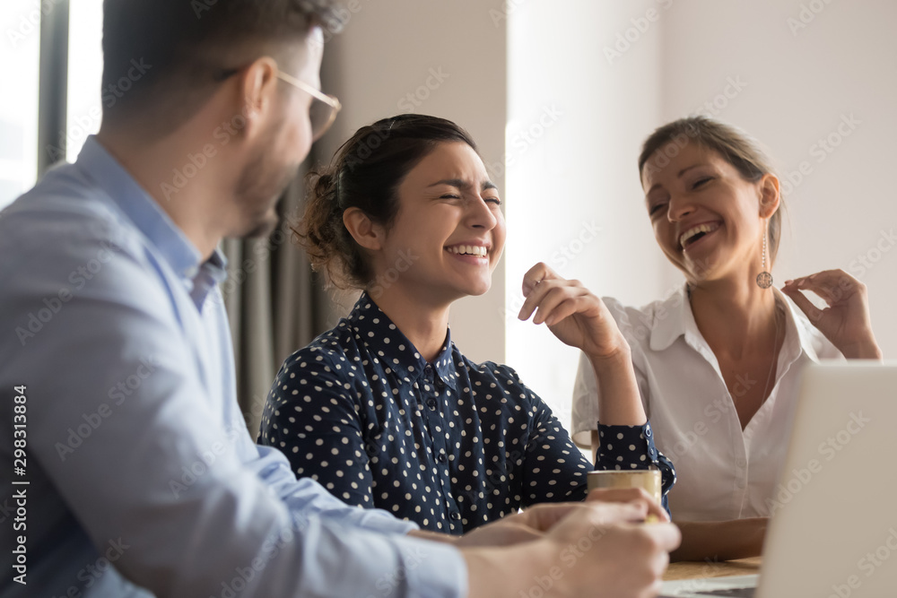 Happy laughing diverse business team of young professionals Happy laughing diverse business team of young professionals