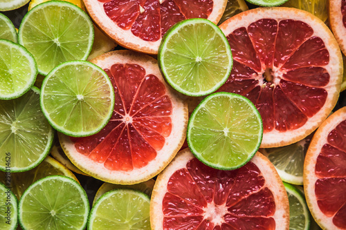 Slices of pink Star Ruby grapefruit and green lime