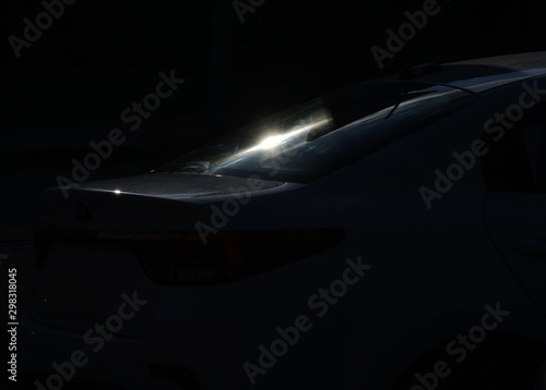 cars photographed during the day on a clamped diaphragm. The effect of the night with the reflection of the sun on the details of the machine.