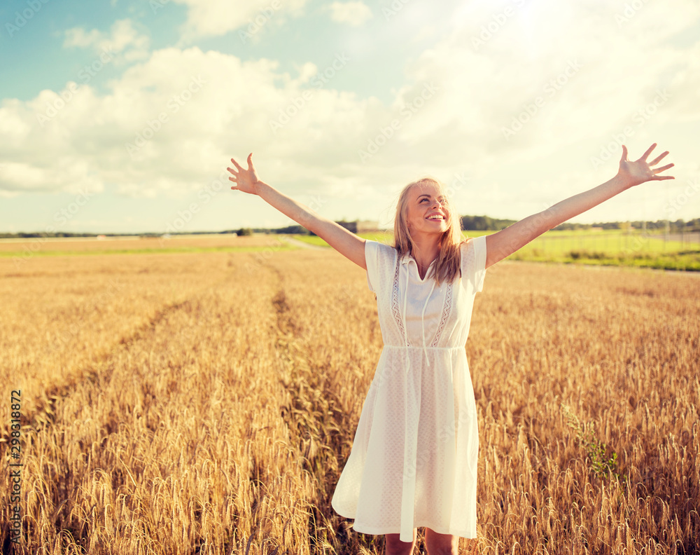 country, nature, summer holidays, vacation and people concept - smiling young woman in white dress on cereal field country, nature, summer holidays, vacation and people concept - smiling young woman in white dress on cereal field