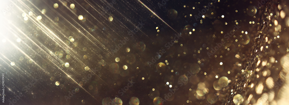 background of abstract glitter lights. gold and black. de focused. banner - obrazy, fototapety, plakaty 
