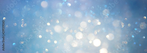 abstract glitter silver, gold , blue lights background. de-focused. banner photo