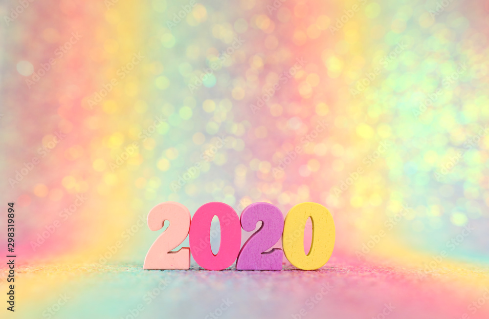 Holiday image of New Year 2020 concept. Wooden number and sparkling background Holiday image of New Year 2020 concept. Wooden number and sparkling background