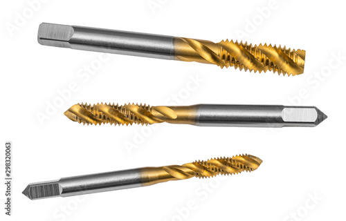 Three steel spiral flute taps isolated on white background. Set of sharp helical grooved drill bits for tapping. Closeup of silver and gold colored cutting tools with titanium coating. Chip machining. photo