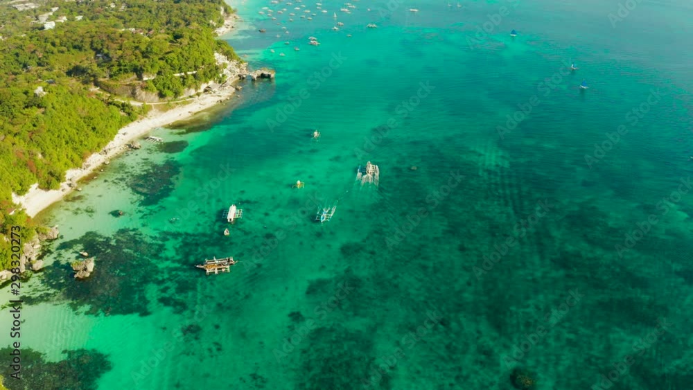 Tropical landscape boats in the turquoise lagoon and tropical beach from above. Seascape with beach on tropical island. Summer and travel vacation concept. Boracay Island, Philippines Tropical landscape boats in the turquoise lagoon and tropical beach from above. Seascape with beach on tropical island. Summer and travel vacation concept. Boracay Island, Philippines