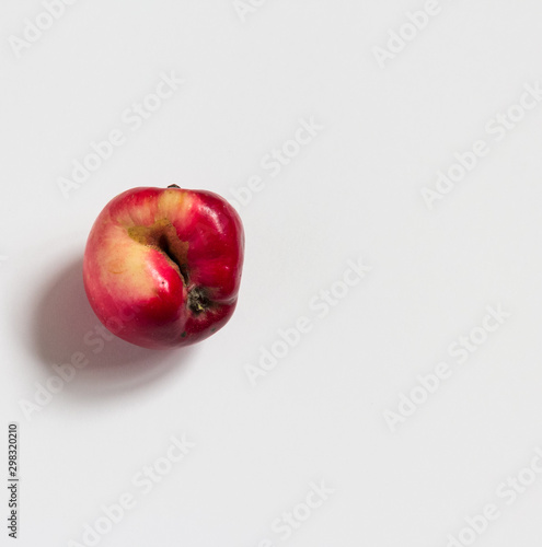 ugly apple on a white background