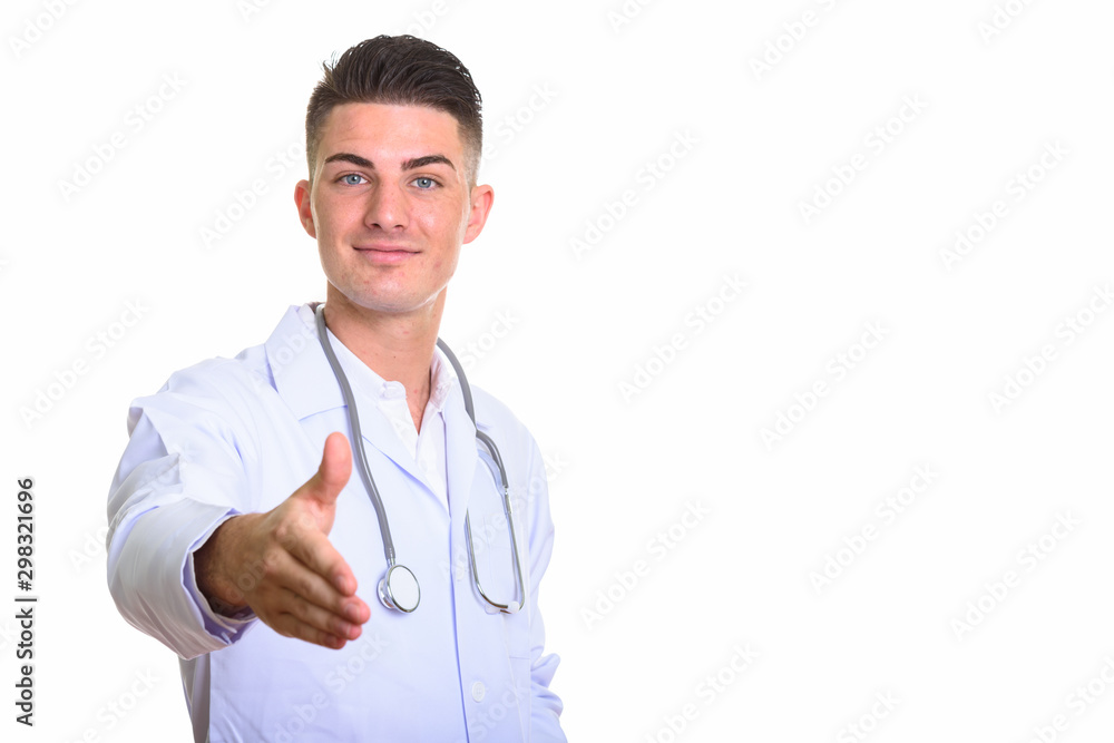 Young handsome man doctor giving handshake and smiling Young handsome man doctor giving handshake and smiling