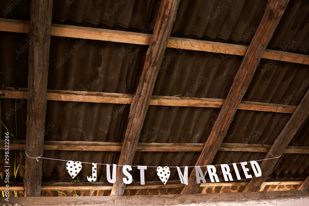 signboard just maried under loft roof. Wedding concept. Wedding in vintage style. signboard just maried under loft roof. Wedding concept. Wedding in vintage style.