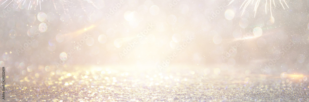 abstract background of glitter vintage lights . silver and white. de-focused