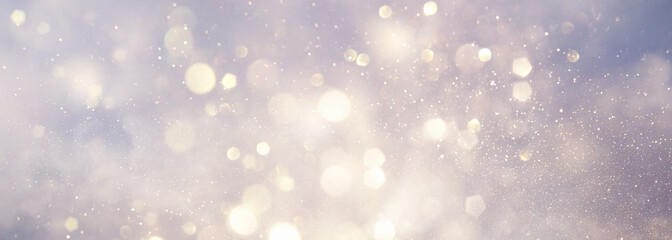 abstract backgrounf of glitter vintage lights . silver and white. de-focused. banner
